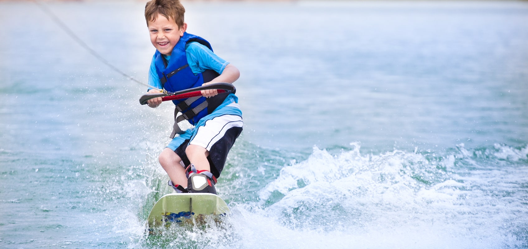 Kid on a wakeboard