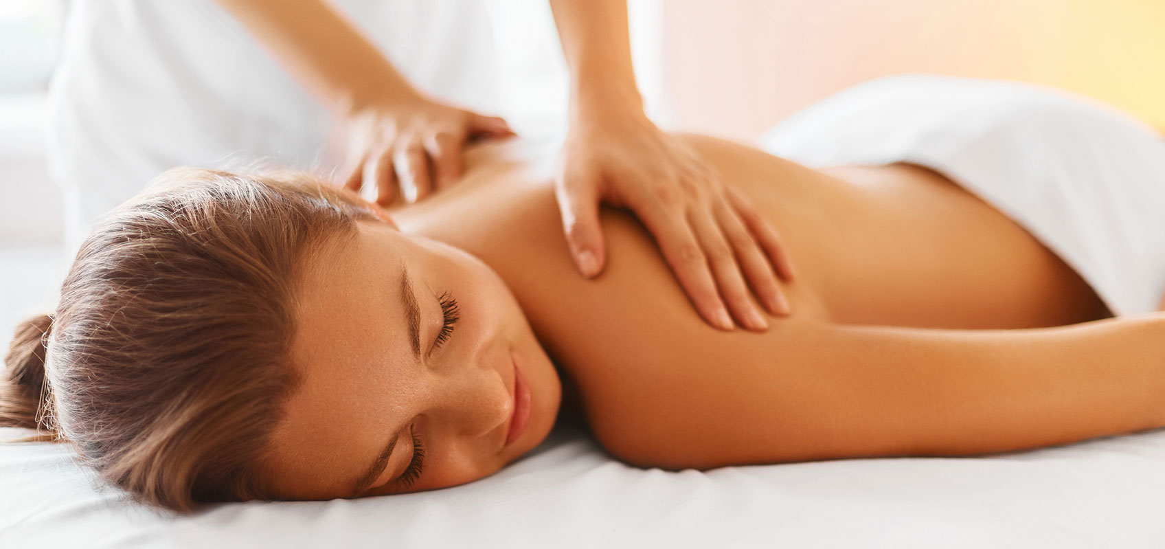 woman lying down on a massage table