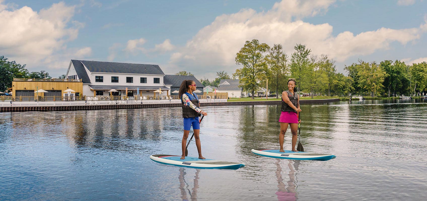Two women paddle boarding