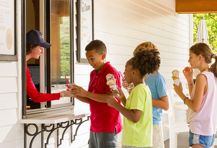 Happy children eating ice cream at Sylvan Beach Supply Co.