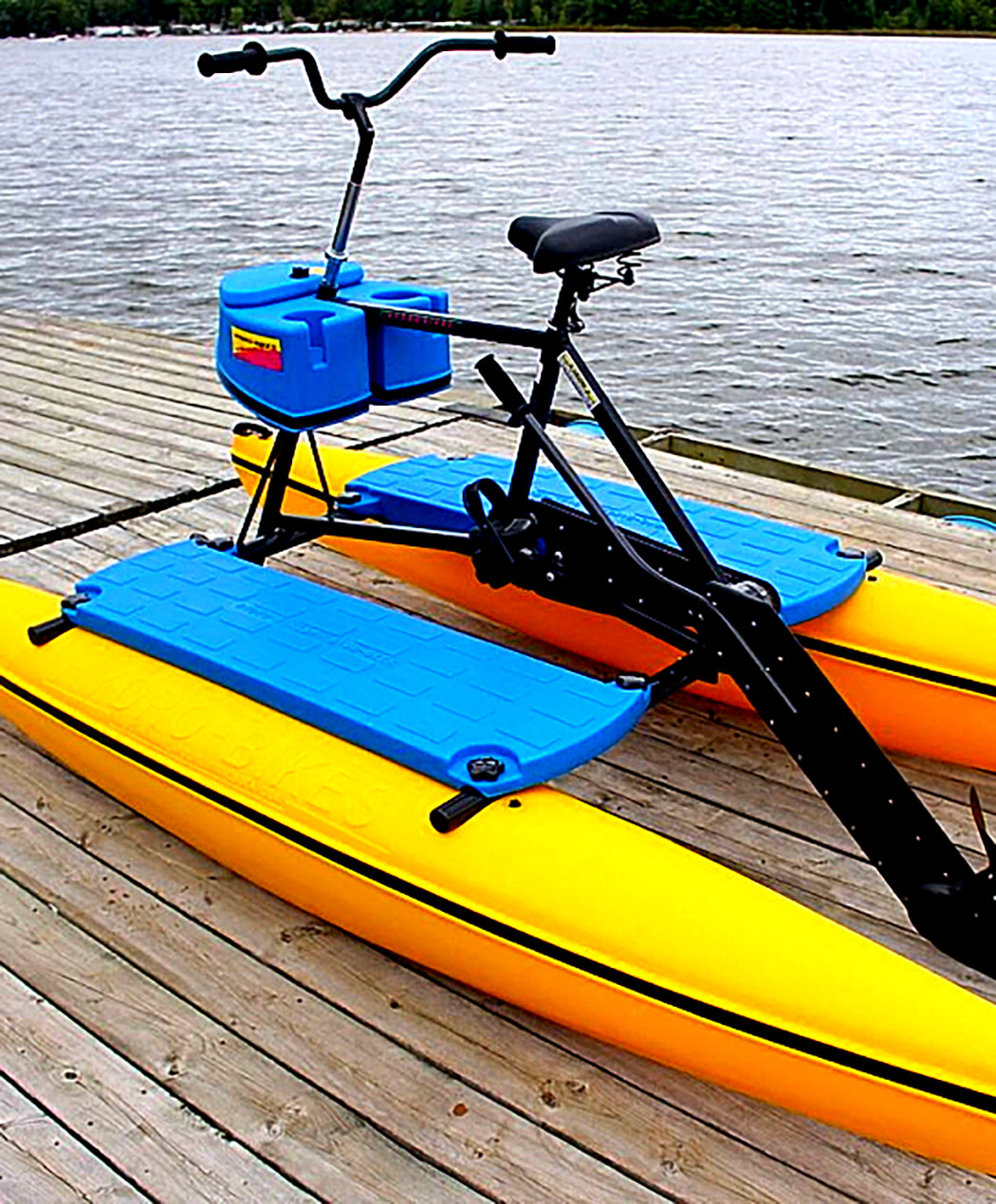 blue and yellow water bike on wooden dock