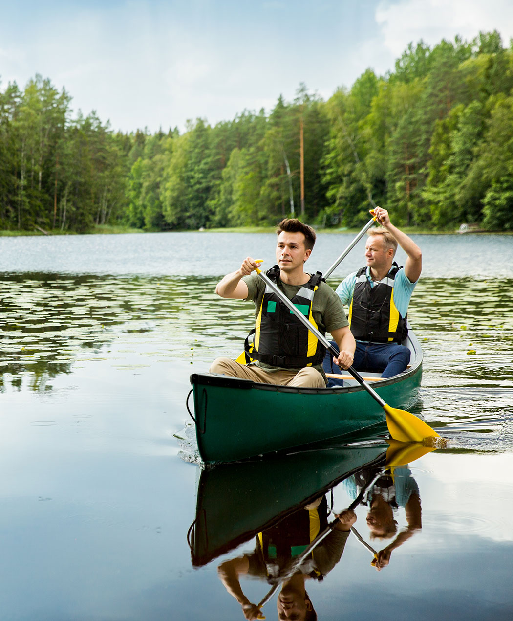 two men in canoe on lake