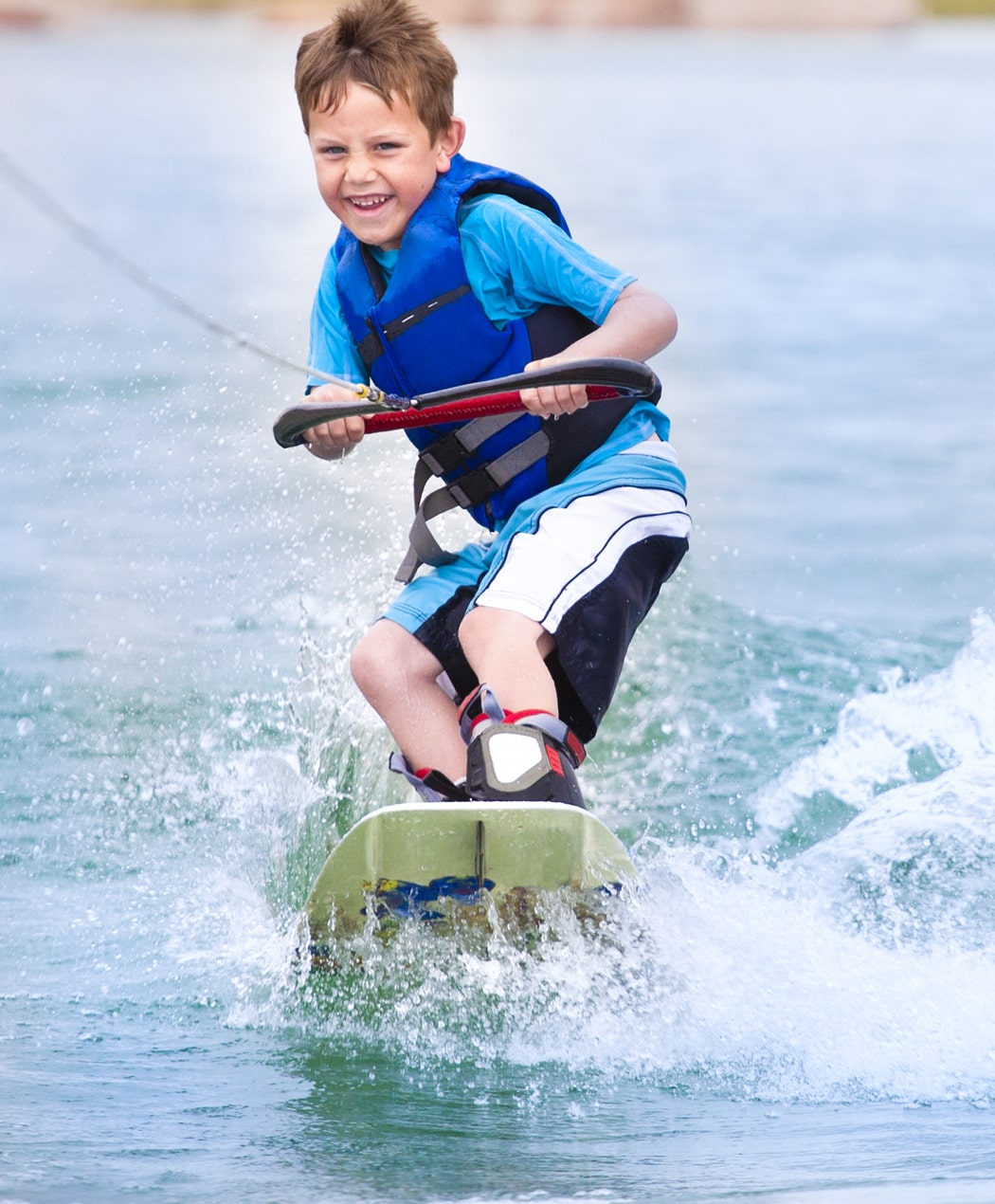 Kid on a wakeboard