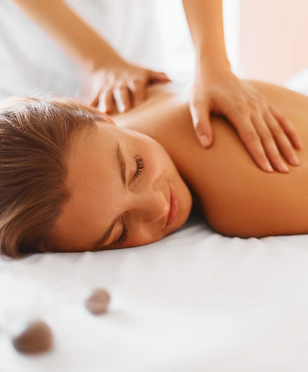 woman lying down on a massage table