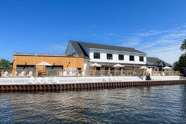 The Cove Featured in Travel + Leisure: "This Waterfront Hotel Is Opening on the Largest Lake in New York State — and Every Cottage Has Its Own Boat"