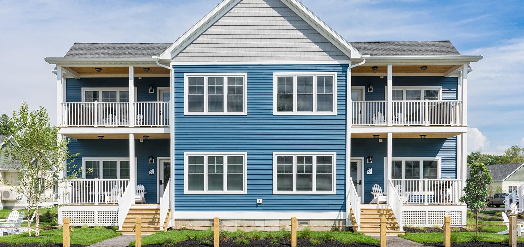 Exterior view of Quad Cottage with blue roof