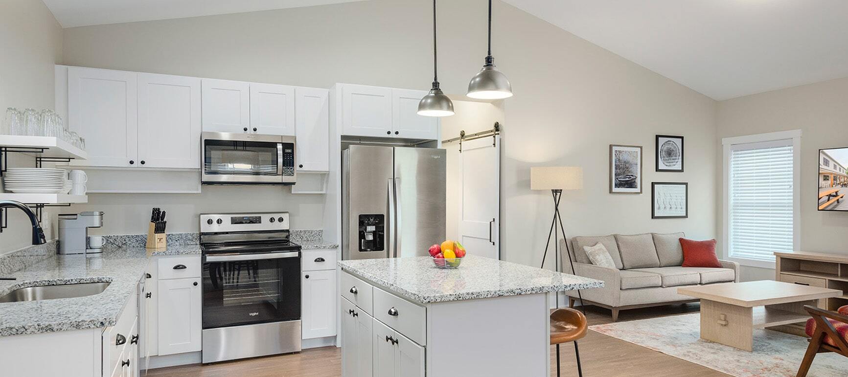 Interior of a well-stocked vacation home kitchen in one of the cottages at The Cove at Sylvan Beach