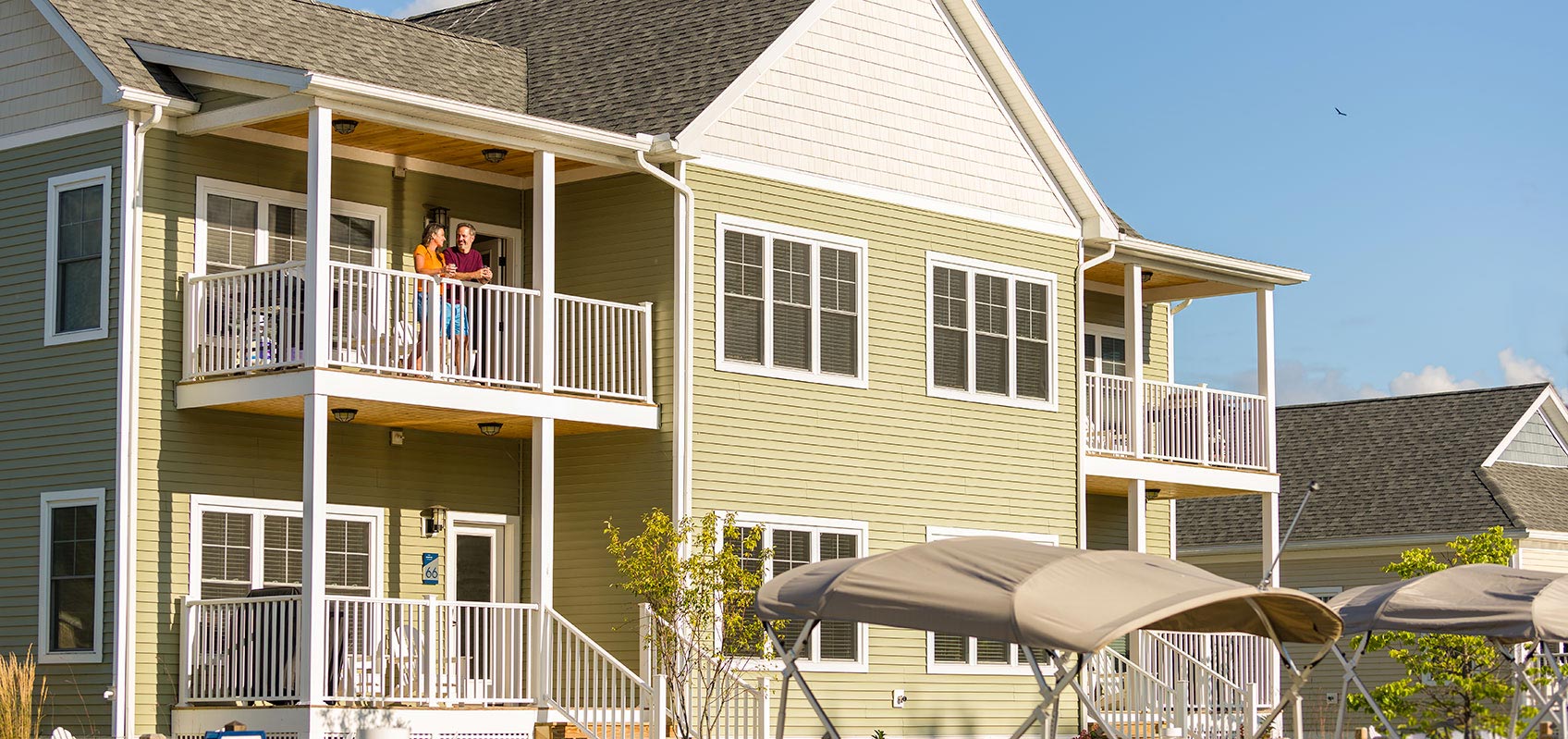 Exterior view of quad yellow cottage