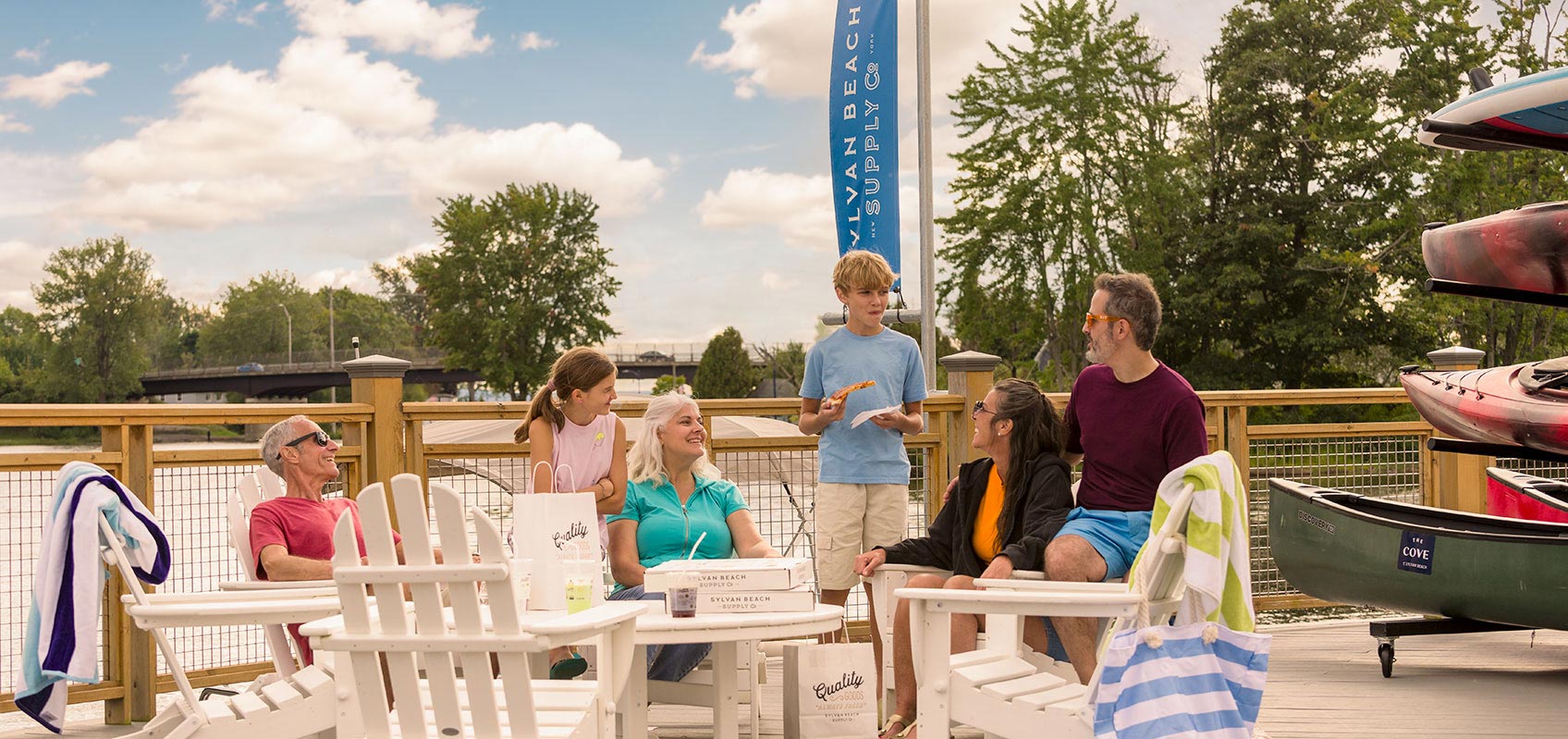 Happy family on a deck sharing a meal